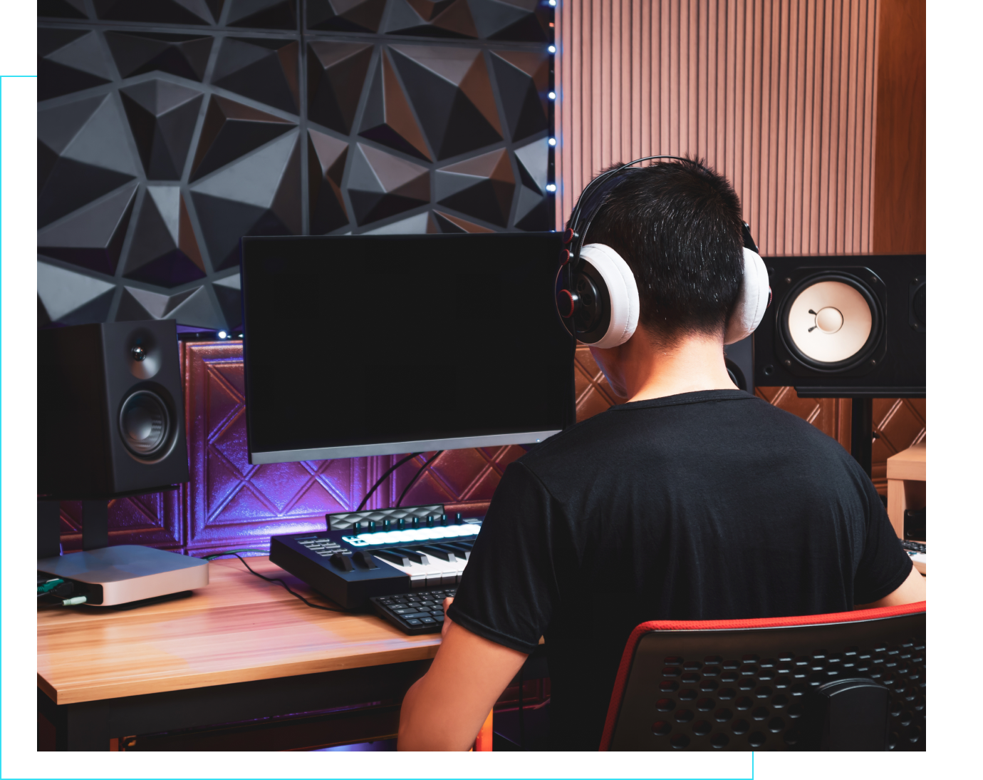 Music producer working at computer station